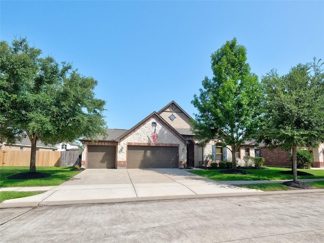 view of front of property featuring a garage and a front yard