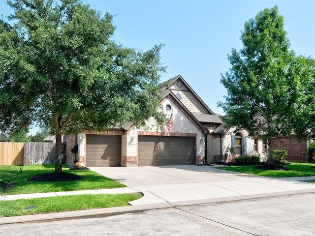 view of front facade with a garage and a front lawn