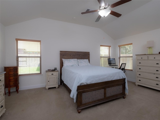 carpeted bedroom with ceiling fan and vaulted ceiling