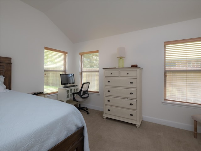 bedroom featuring light carpet, multiple windows, and vaulted ceiling