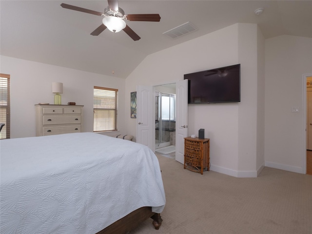 carpeted bedroom with ceiling fan, connected bathroom, and vaulted ceiling