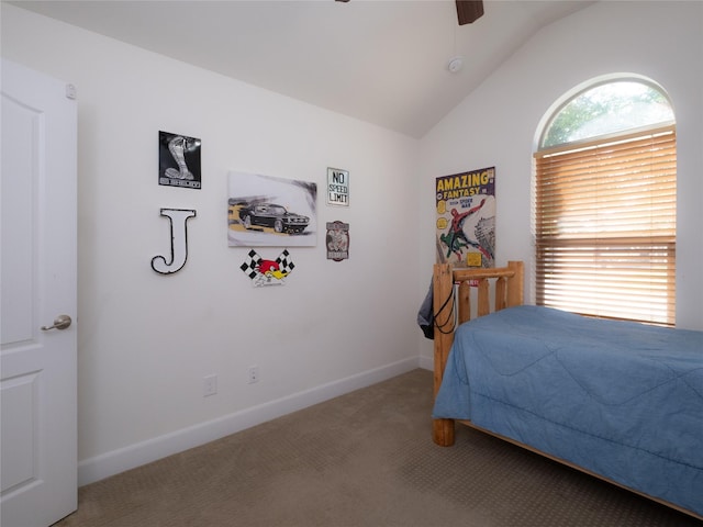 carpeted bedroom featuring lofted ceiling and ceiling fan