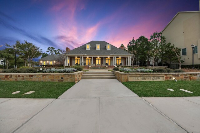 view of front of home featuring a yard and covered porch