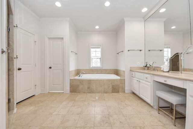 bathroom with tiled tub, crown molding, and vanity