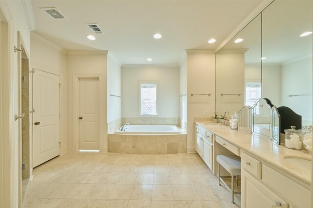 bathroom with a relaxing tiled tub, ornamental molding, and vanity