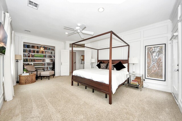 bedroom featuring crown molding, carpet, and ceiling fan