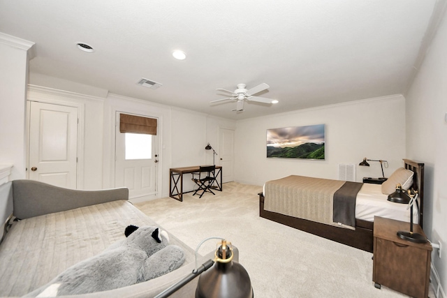 bedroom featuring crown molding, light carpet, and ceiling fan