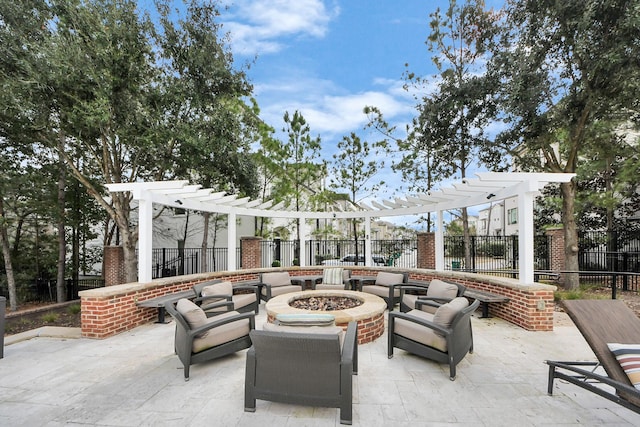 view of patio / terrace with an outdoor fire pit and a pergola