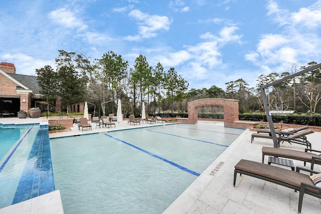 view of swimming pool with a patio area