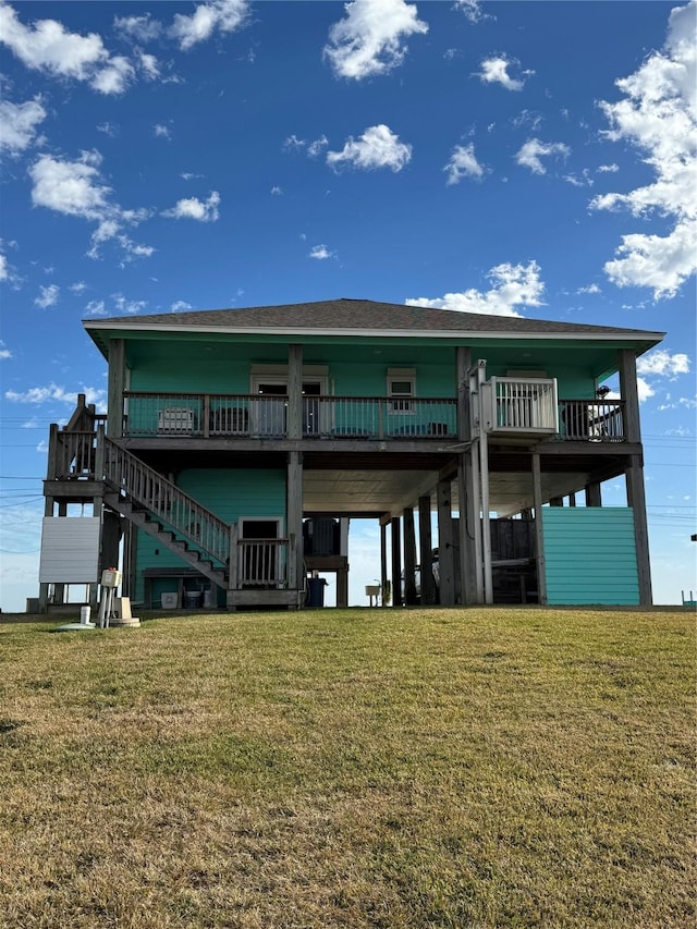 back of property featuring a yard