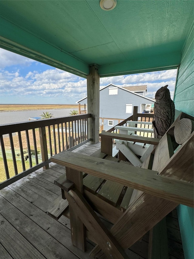 deck featuring a water view