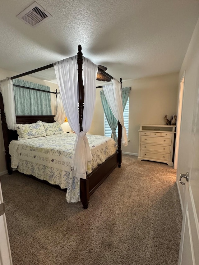 unfurnished bedroom featuring carpet flooring and a textured ceiling