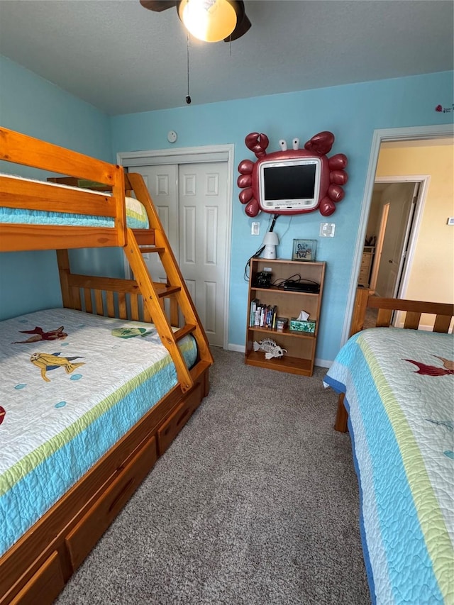 carpeted bedroom with a closet and ceiling fan