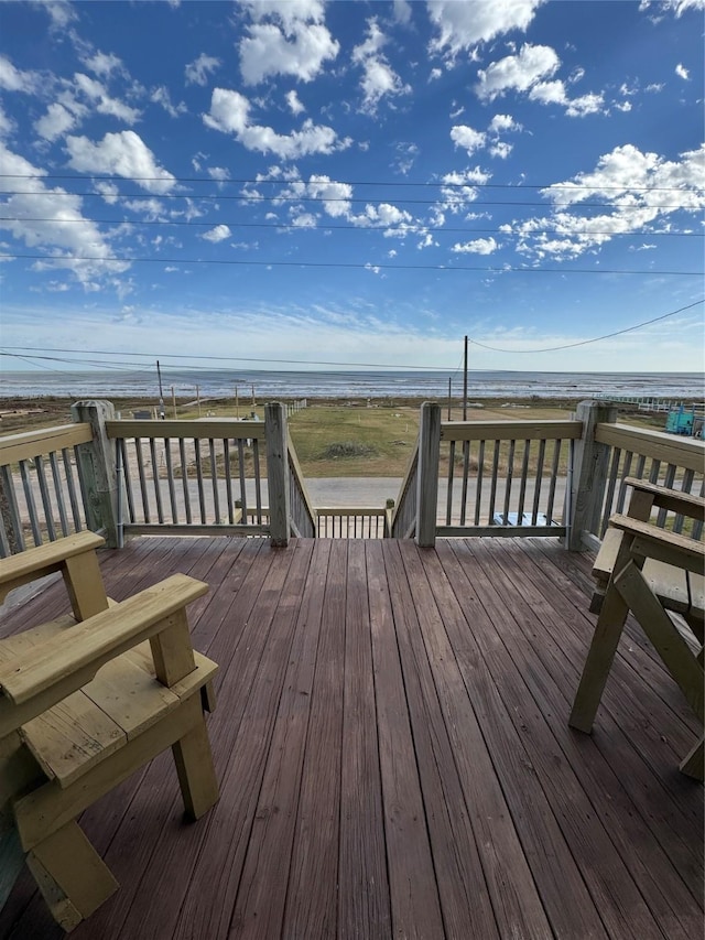 wooden deck featuring a water view