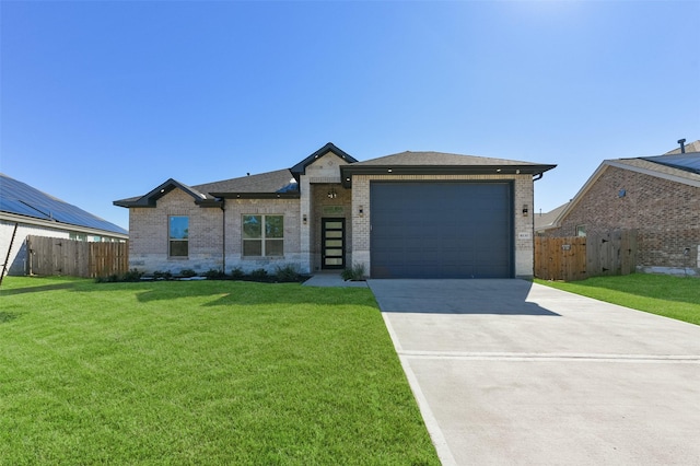 ranch-style house with a garage and a front lawn