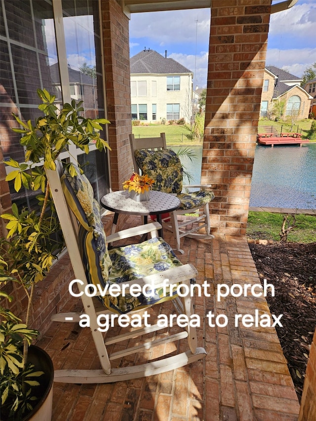 view of patio featuring a water view