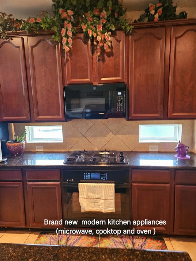 kitchen featuring tasteful backsplash, light tile patterned floors, and black appliances