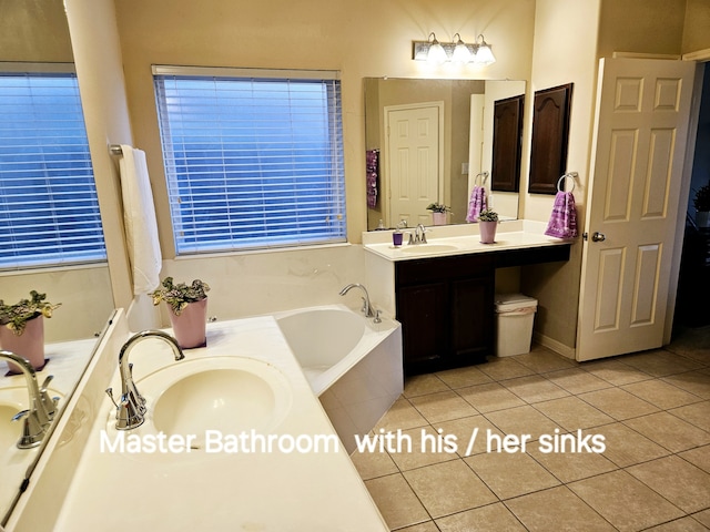 bathroom featuring tile patterned flooring, vanity, and a bathtub