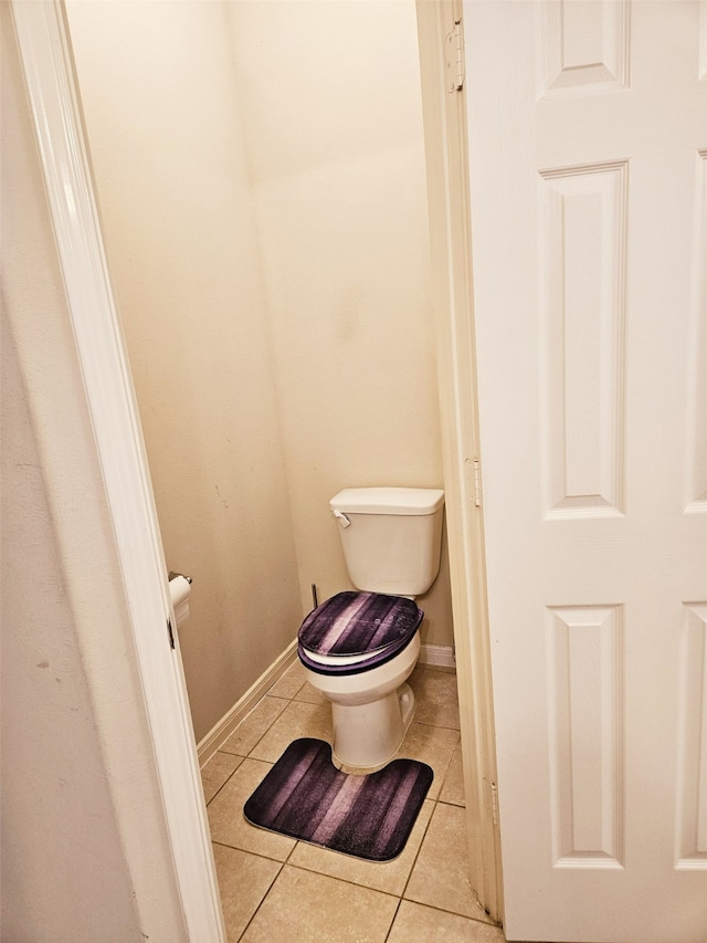 bathroom with tile patterned floors and toilet