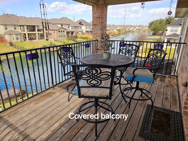 wooden deck with a water view