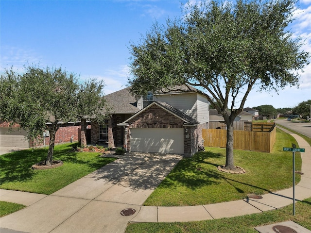 view of front of home with a garage and a front yard