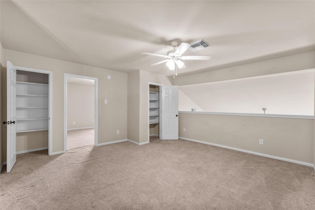 unfurnished bedroom with light colored carpet and ceiling fan