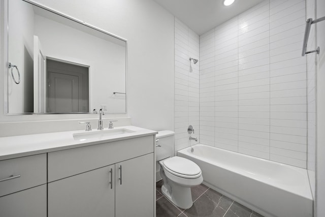 full bathroom featuring vanity, toilet, and tiled shower / bath