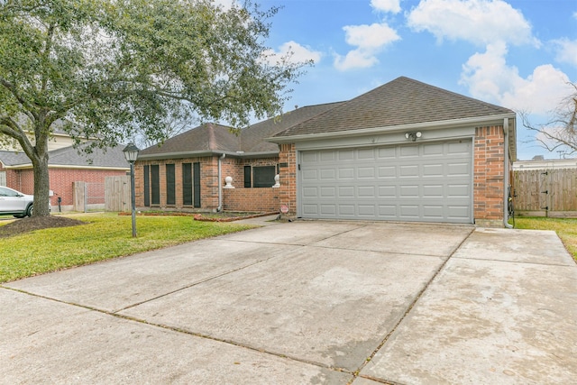 view of front of home with a garage and a front lawn