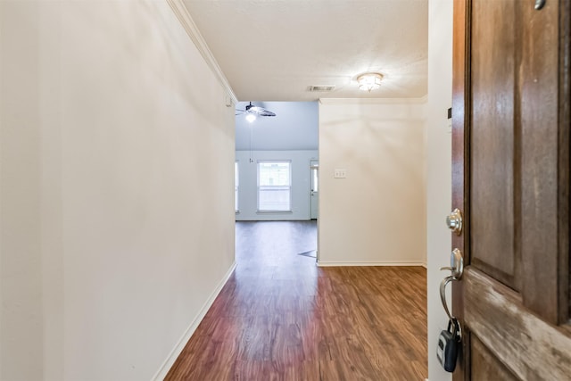 entrance foyer with crown molding, ceiling fan, and hardwood / wood-style flooring