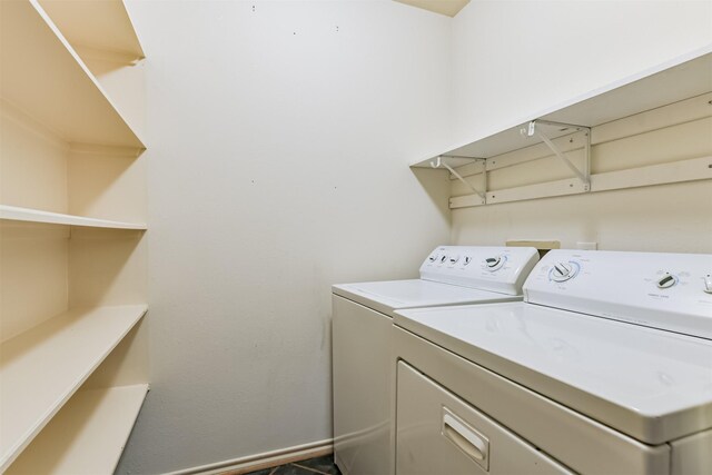 clothes washing area featuring washing machine and clothes dryer