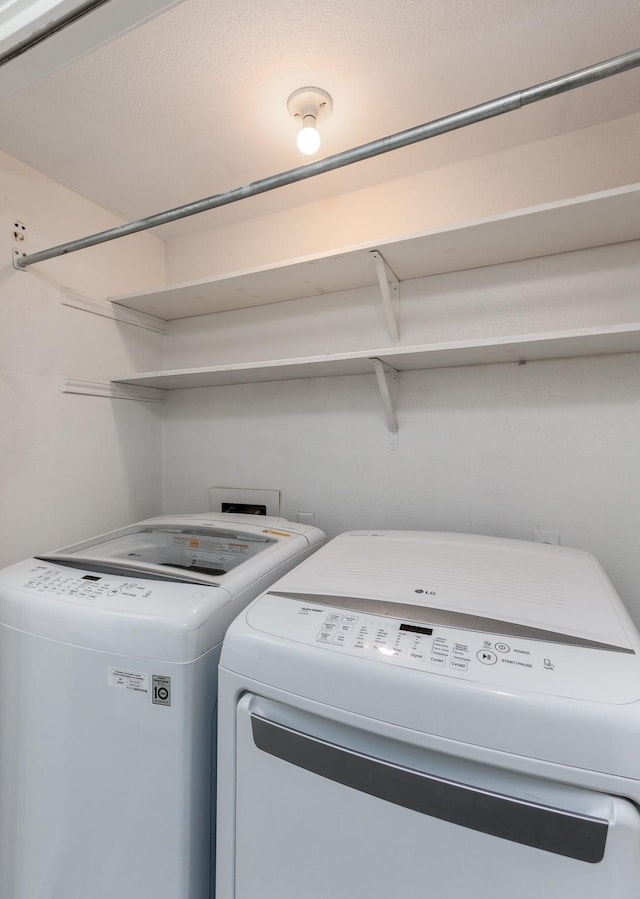 laundry room with washing machine and dryer