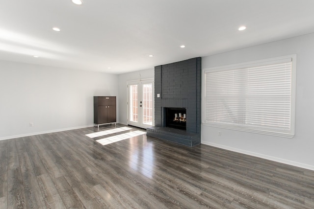 unfurnished living room with recessed lighting, french doors, baseboards, and dark wood-style flooring