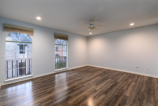 empty room with ceiling fan, baseboards, dark wood-style flooring, and recessed lighting