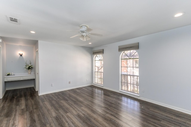 unfurnished room featuring a ceiling fan, baseboards, dark wood-type flooring, and recessed lighting