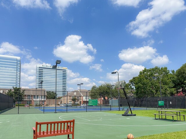 view of sport court with basketball hoop