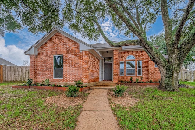 view of front of home with a front lawn