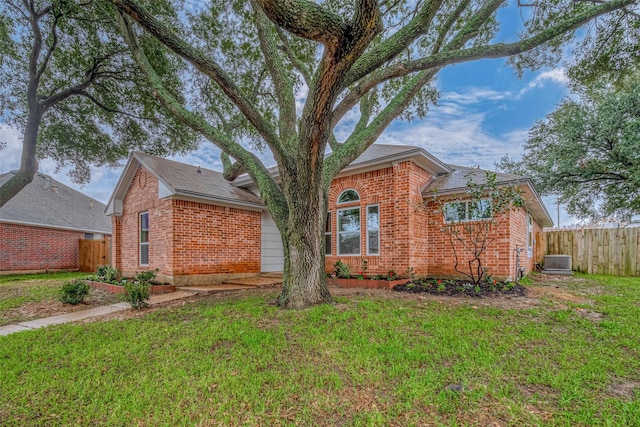 view of front of house featuring central AC and a front yard