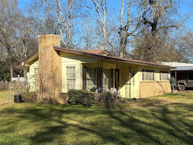 view of home's exterior with a yard