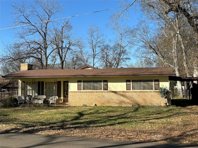 ranch-style house with a front lawn