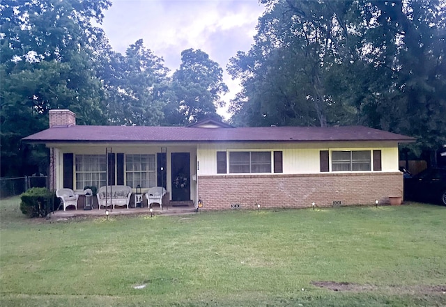 504 E Bell Ave, Crockett, TX 75835 - ranch-style house featuring brick siding and a chimney