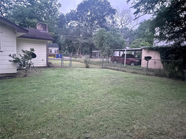 504 E Bell Ave, Crockett, TX 75835 - view of yard with a carport