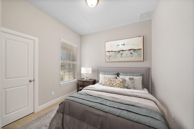 bedroom with visible vents, baseboards, and carpet flooring