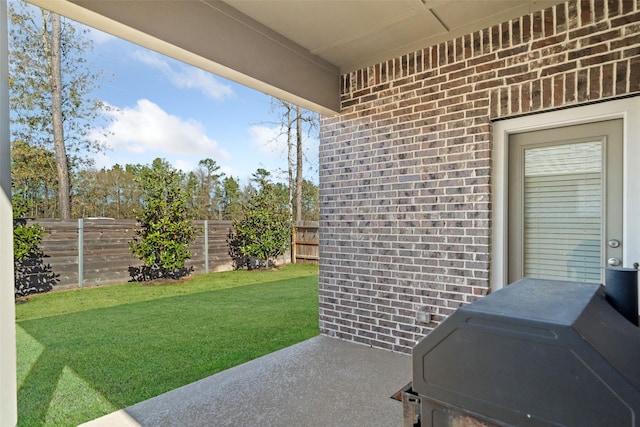 view of patio with a fenced backyard and area for grilling