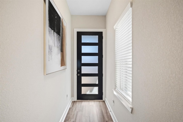 15527 Sunset Maple Ct, Conroe, TX 77302 - entryway with wood finished floors and baseboards