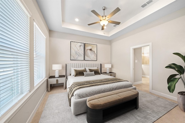 15527 Sunset Maple Ct, Conroe, TX 77302 - bedroom featuring light carpet, a tray ceiling, a ceiling fan, baseboards, and recessed lighting