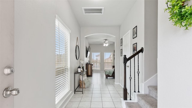 entrance foyer with light tile patterned floors and ceiling fan