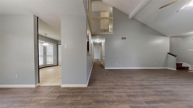 unfurnished living room featuring stairs, wood finished floors, visible vents, and a ceiling fan