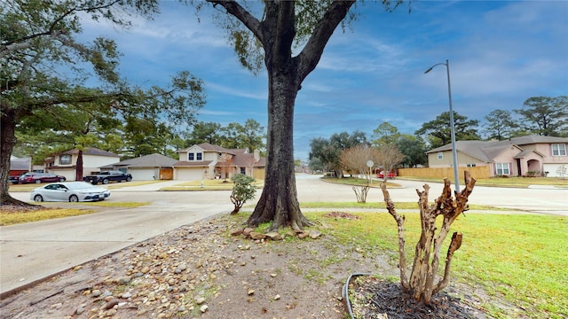 view of yard featuring a residential view and fence