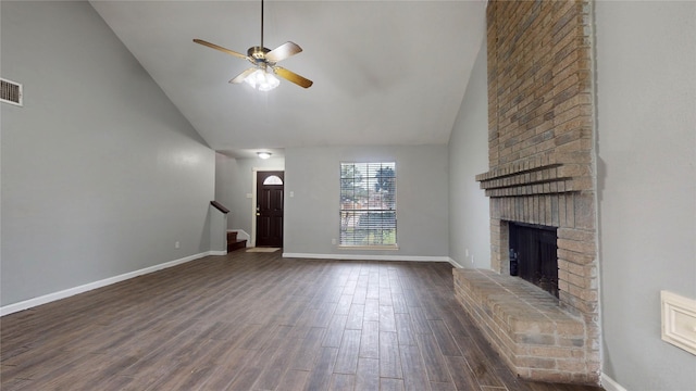 unfurnished living room with baseboards, ceiling fan, dark wood-type flooring, stairs, and a brick fireplace