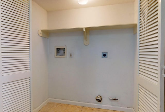 clothes washing area with light tile patterned flooring, hookup for a gas dryer, laundry area, washer hookup, and electric dryer hookup